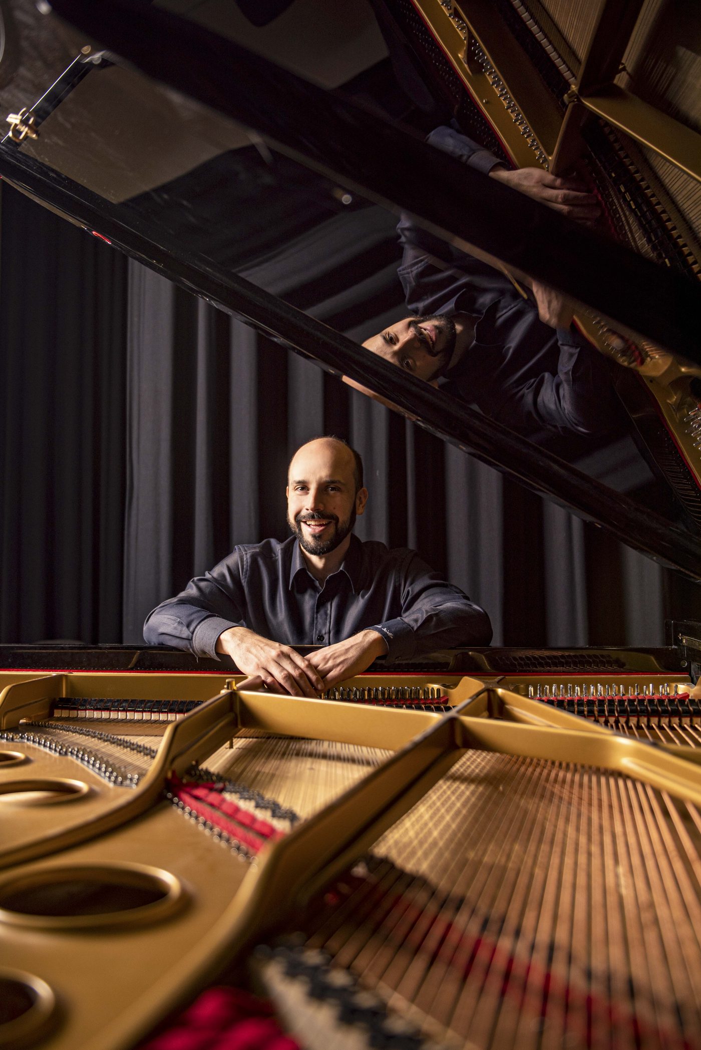 Claude Diallo at the open grand piano